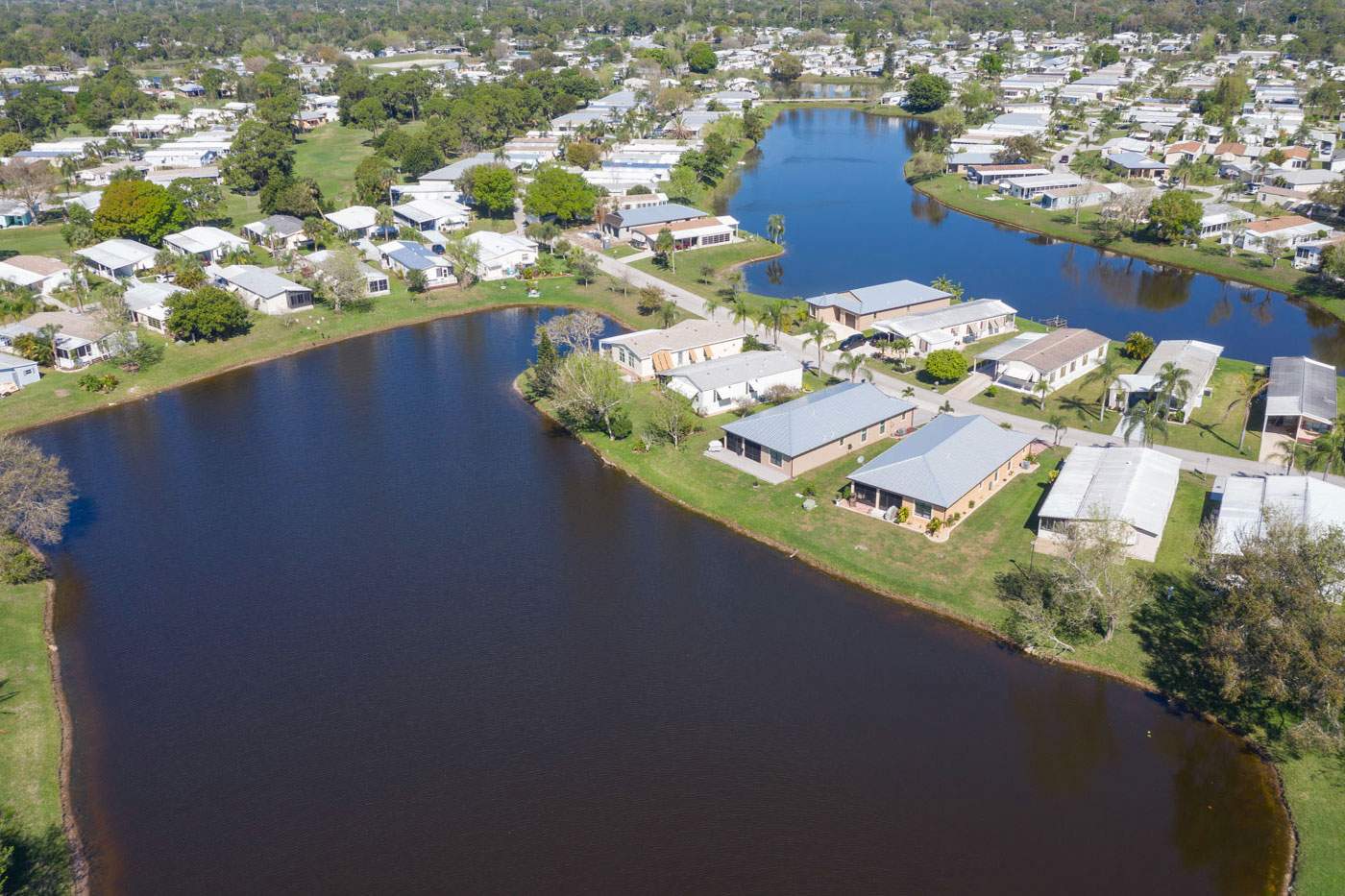 Homes for Sale. Aerial view of homes surrounding beautiful lakes.